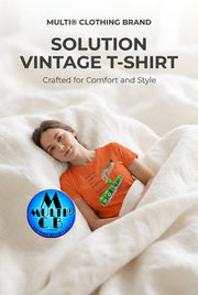 Solution - Ladies Vintage T-Shirt 100% combed and ringspun cotton in orange, worn by a woman lying in bed, showcasing comfort and casual style.